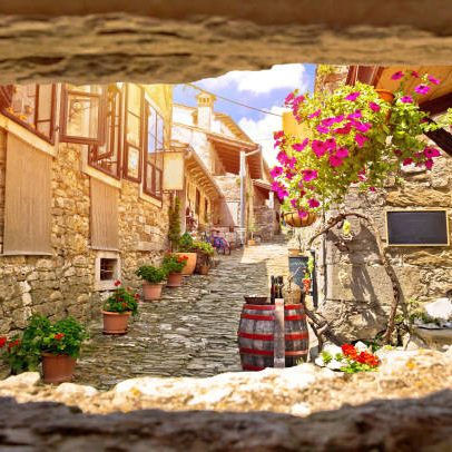 Town of Hum colorful old stone street view through stone window, Istria region of Croatia